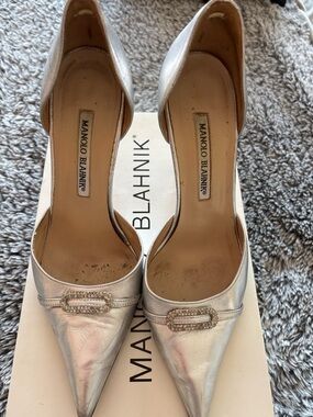Manolo Blahnik Trolopado Silver Nappa Leather D'Orsay Pumps with Crystal Buckle.